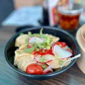 Dumplings with radish and cherry tomatoes