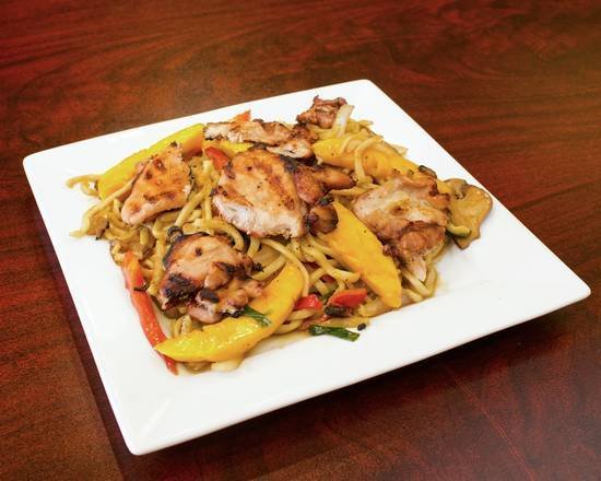 Grilled chicken with mango and vegetables over noodles
