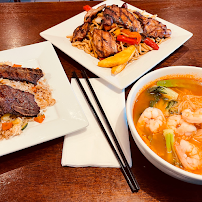 Grilled chicken, ribs, and shrimp noodle soup